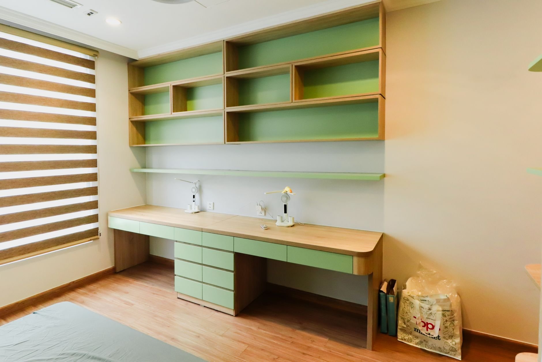 Spacious home office with wooden shelves and warm natural lighting
